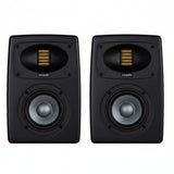 Black studio monitor speaker with visible branding on a white background